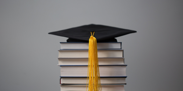 graduation-cap-on-top-of-books-2